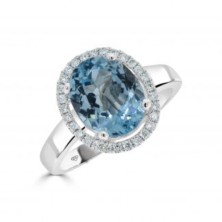 Diamond And Blue Topaz Oval Shaped Dress Ring