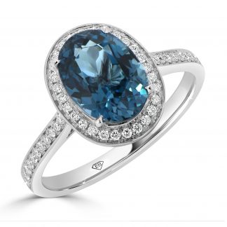 Oval London Blue Topaz with round diamond halo ring