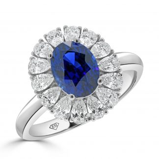 Oval sapphire and pear shaped diamond halo ring