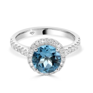 18ct White Gold Blue Topaz and Diamond Halo RingBlue topaz engagement ring