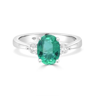 Oval-Cut Emerald and Diamond Trilogy Ringoval cut emerald engagement ring