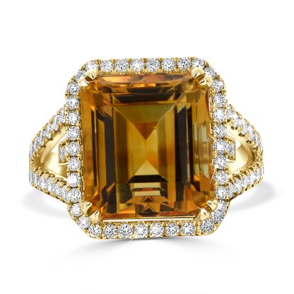 Yellow citrine and diamond cocktail ring in 18kt yellow gold with emerald-cut citrine and diamond halo.