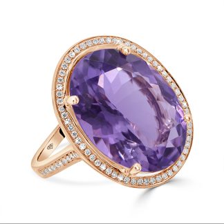 Oval-Cut Amethyst Ring in 18kt Rose Gold with DiamondsOval-cut amethyst ring in 18kt rose gold featuring an 11.17ct amethyst with diamond halo accents.