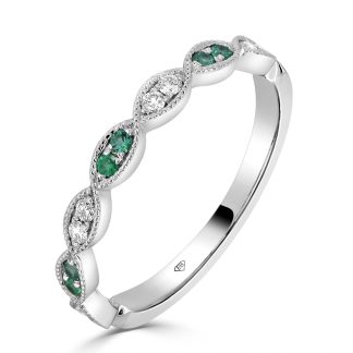 Emerald and Diamond Band Wedding Ring in 18ct GoldDiamond band wedding ring with emerald accents in 18ct white gold, featuring milgrain detailing and marquise-shaped settings.